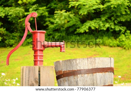 red water pump in field