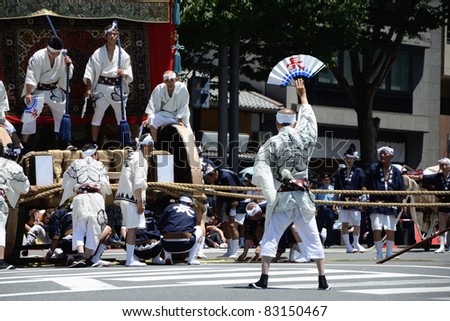 KYOTO, JAPAN - JULY 17: Unidentified men move a decorated float during ...