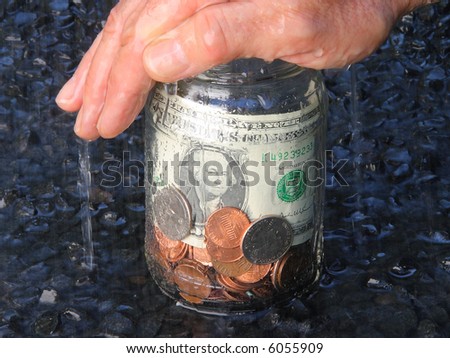 Protect your money. Money in a jar under the rain.