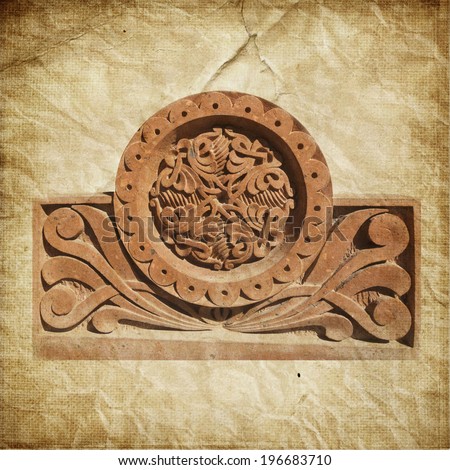 Medieval Armenian ornament on cross stone over paper background
