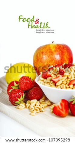 Fresh corn flakes with strawberries close up isolated on white