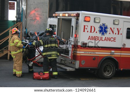 NEW YORK CITY - JAN 9: Person injured in a ferry accident at Pier 11 is put into an ambulance in Lower Manhattan on January 9, 2013 in New York City, NY.