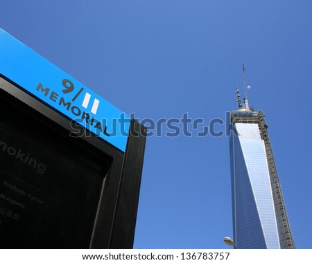 NEW YORK CITY - APRIL 27: Entrance to the National 9/11 Memorial.  World Trade Center Tower One in the background in Lower Manhattan on April 27, 2013 in New York City, NY.