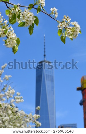 New York City, USA - May 3, 2015: Spring in bloom near the newly opened World Trade Center Tower One at Ground Zero in New York City.