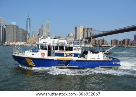 New York City, USA - August 16, 2015: NYPD boat responding to an emergency on the East River in New York City.