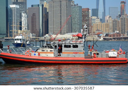 New York City, USA - August 16, 2015: FDNY boat responding to an emergency on the East River in New York City.