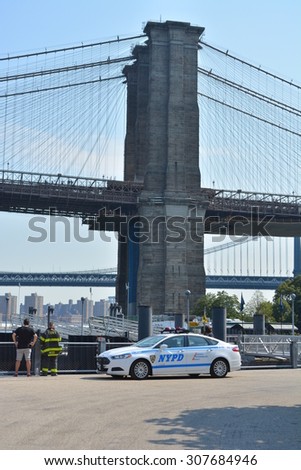 New York City, USA - August 16, 2015: New York City Police cruiser at Brooklyn Bridge Park responding to an emergency on the East River in New York City.