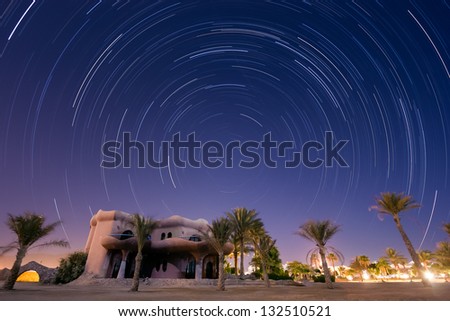 Star trails around the pole star from a tropical desert resort