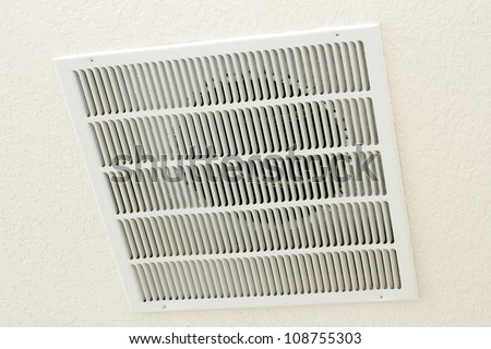 Large square white return air vent located in the ceiling of a home.