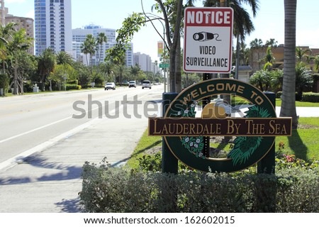 LAUDERDALE BY THE SEA, FLORIDA - FEBRUARY 1: Welcome sign into a small town with a population of 6,258 in 2012 north east of Fort Lauderdale on February 1, 2013 in Lauderdale-By-The-Sea, Florida.