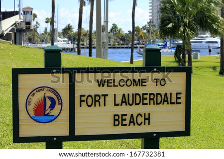 FORT LAUDERDALE, FLORIDA - FEBRUARY 3: Welcome to Fort Lauderdale Beach sign in Merle Fogg / Idlewyld park near Las Olas Intracoastal waterway drawbridge on February 3, 2013 in Ft Lauderdale, Florida