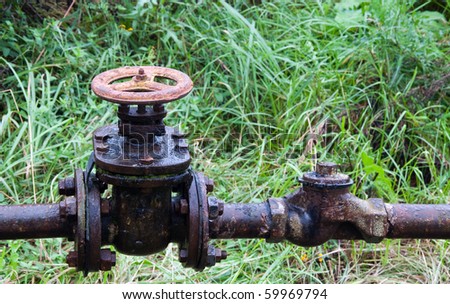 old leaked  rusty country water supply system