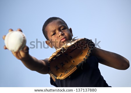 Sport, baseball and kids, portrait of child with glove holding ball and looking at camera