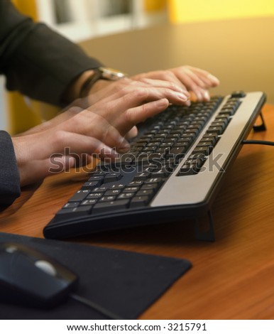 people at work: motivated businessman typing fast