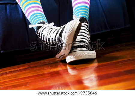 girl in a waiting room. Close up of her footwear