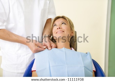 dentist and his patient in examination room. Copy space