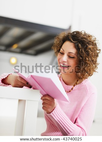 woman reading book at home. Copy space