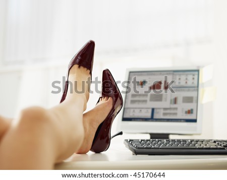 business woman taking off shoes in office. Copy space