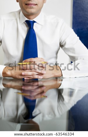 cropped view of businessman with hands clasped. Vertical shape, front view
