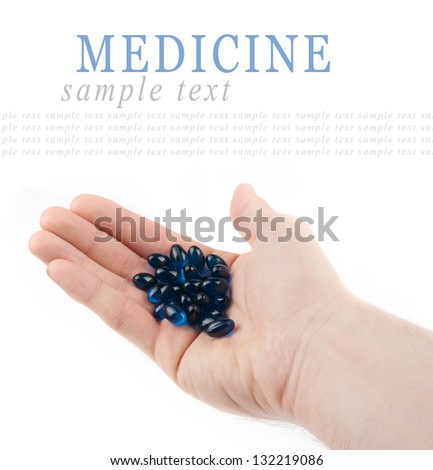 Hand holding a pills isolated on white background