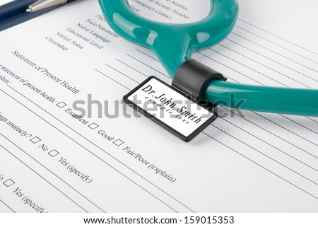 Stethoscope with medical ID tag on medical document (medical questionnaire)