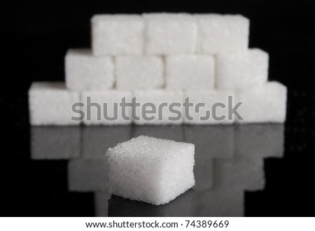 Lump sugar pyramid (sugar cubes) with shallow depth of field