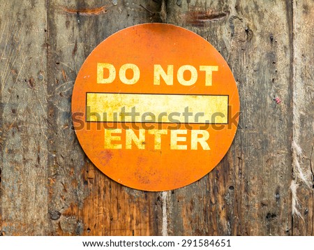 Old Do not enter sign on a wooden  door