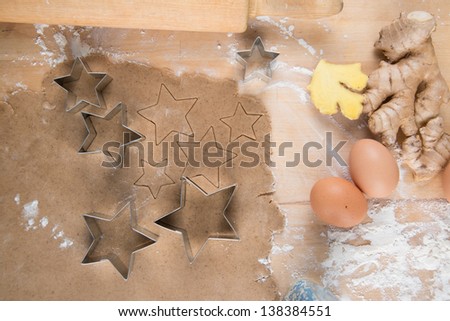 Ginger Cookies Dough With Ingredients and Star Cutters