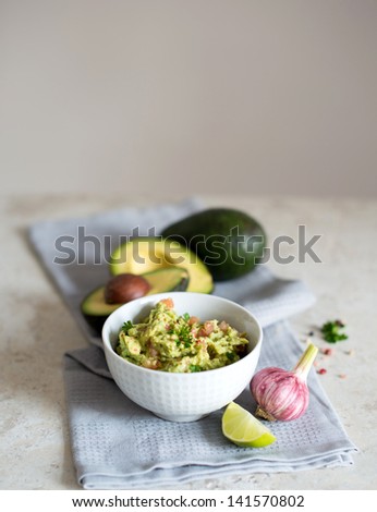 Rustic Look of Avocado and Tomatoes Dip with Fresh Pink Garlic