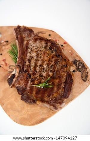 Cooked Beef Steak on Bone with Herbs and Spices