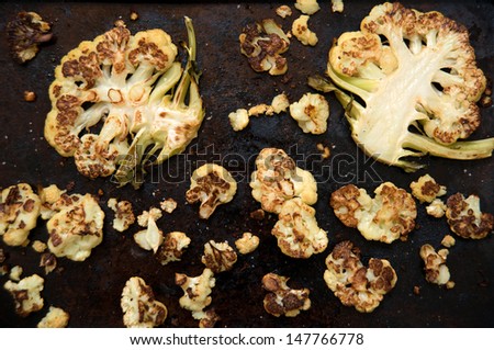 Rustic Look of Cauliflower Cut and Baked on Old Cookie Sheet with Butter, Salt, and Spices