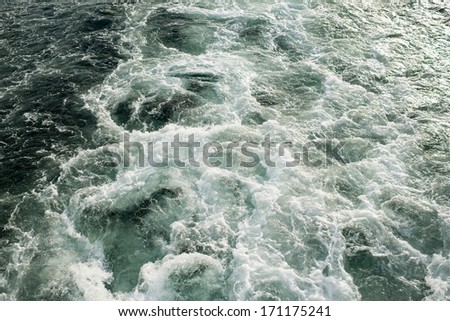 Wake of Water after Big Boat Winter Ocean