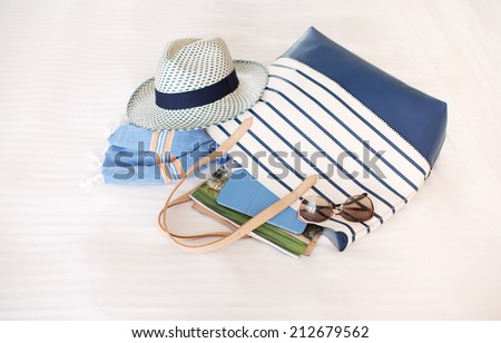 Tote Bag Full of Summer Beach Essentials , Hat, Towels, Sunglasses, Tablet