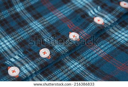 Close up of Blue Plaid Flannel Shirt with White Buttons