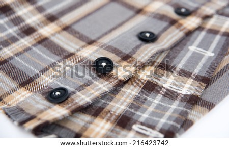 Close up of Black and Brown Plaid Flannel Shirt