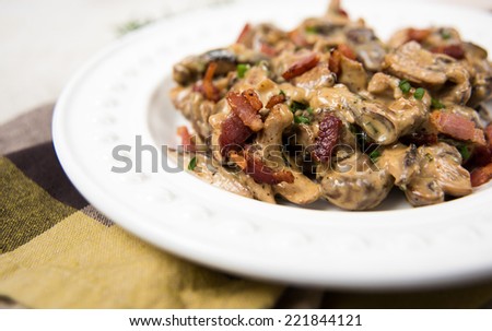 Mushroom Ragout Cooked with Wine, Heavy Cream, Bacon, and Fresh Herbs