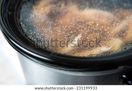 Chicken Legs Bone Broth Being Cooked in Slow Cooker