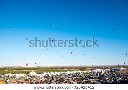 ALBUQUERQUE, NEW MEXICO - OCTOBER 6, 2015: Balloons fly over Albuquerque, New Mexico. International balloon fiesta is the biggest hot air balloon event in the world.