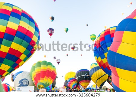 ALBUQUERQUE, NEW MEXICO - OCTOBER 6, 2015: Hot Air Balloons fly over Albuquerque, New Mexico. International balloon fiesta is the biggest hot air balloon event in the world.