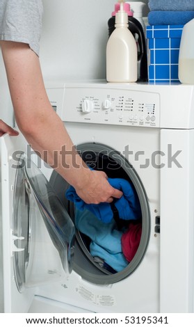 Putting Dirty laundry into Washer