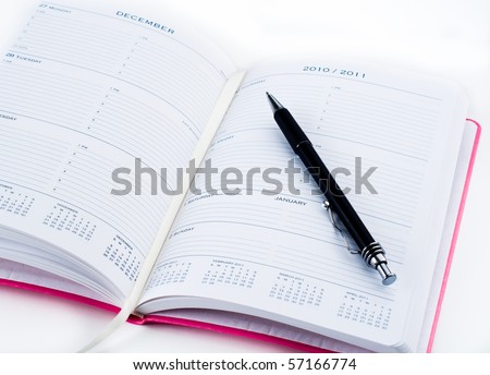 Pink Planner Opened on Page of Changing Years