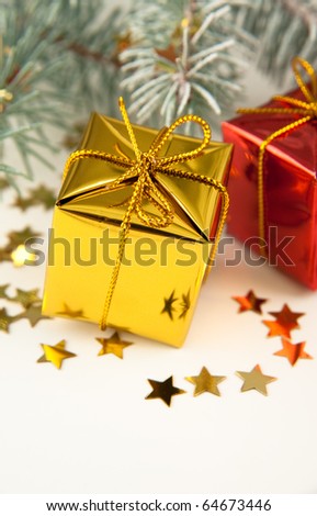 Cute Gold and Red Wrapped Christmas Presents on Pine Branches
