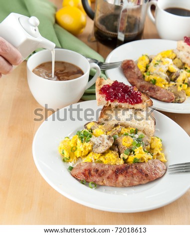Traditional American Breakfast with Eggs, Sausage and Toast