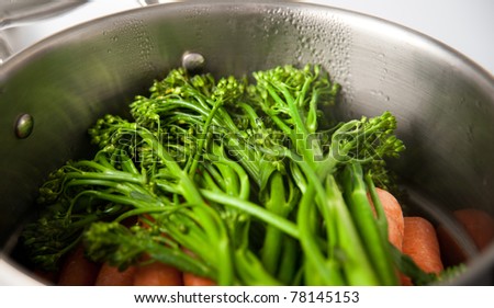 Steaming Broccolini and Carrots in Stainless Steel Pot