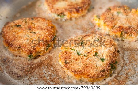 Frying Salmon and Sweet Potato Cakes with Fresh Parsley