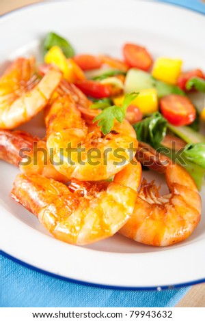 Closeup of Whole Fried Jumbo Shrimp with Sauteed Vegetables