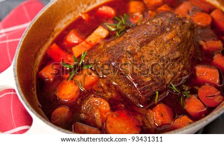 Round Beef Roast Prepared with Carrots and Yams in French Oven