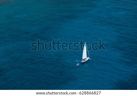 Similar – Image, Stock Photo Lonely yacht in gray water with dark mountains under cloudy sky