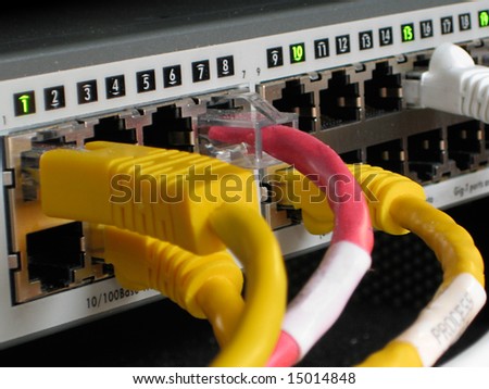 Industrial Switch with several Ethernet cable connections showing activity