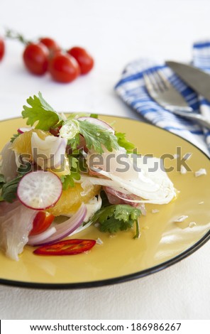 Green salad with fish and radish